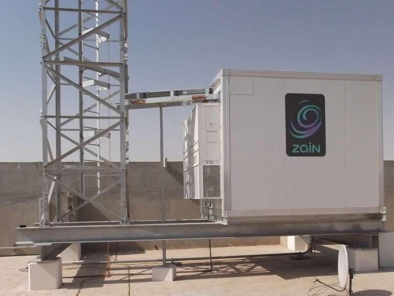 Telecom shelter and tower installed on a rooftop for Zain network