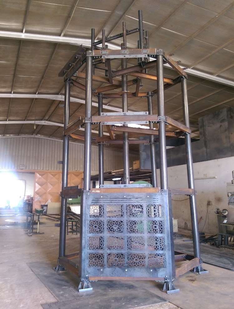 Decorative laser-cut steel screen structure under fabrication
